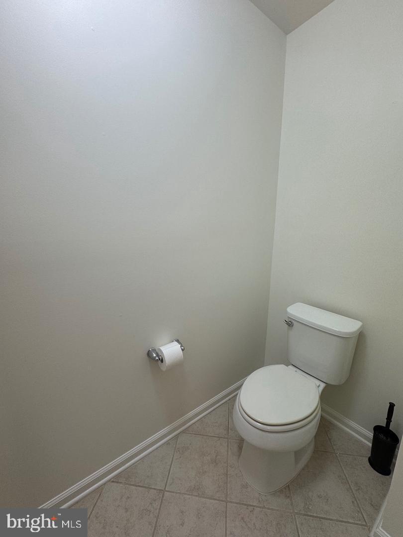 7925 Alchemy Way Elkridge, MD 21075 - Photo 33 of 46 a white toilet sitting next to a shower