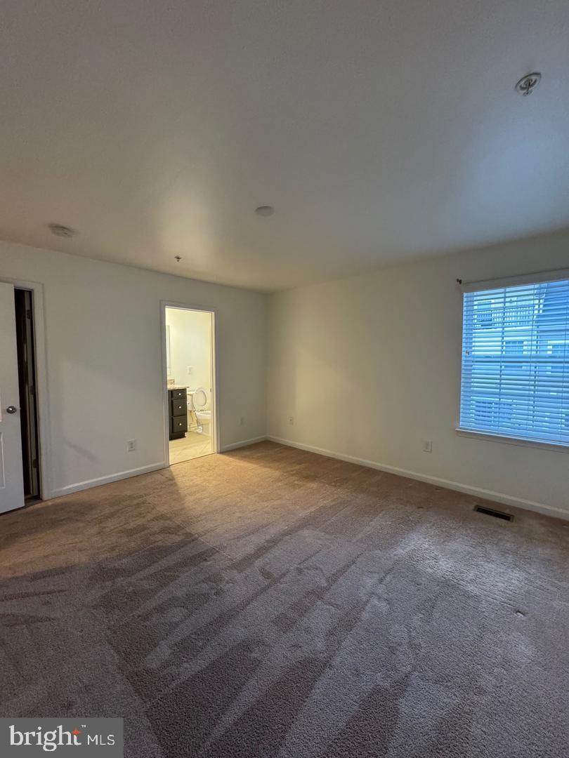 7925 Alchemy Way Elkridge, MD 21075 - Photo 37 of 46 a view of an empty room with a window