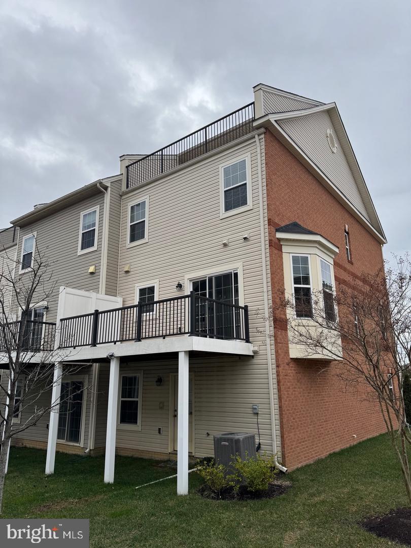 7925 Alchemy Way Elkridge, MD 21075 - Photo 4 of 46 a view of a house with a yard