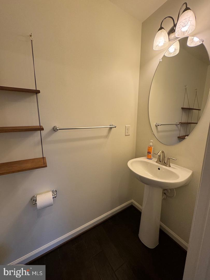 7925 Alchemy Way Elkridge, MD 21075 - Photo 46 of 46 a bathroom with a sink a mirror and vanity