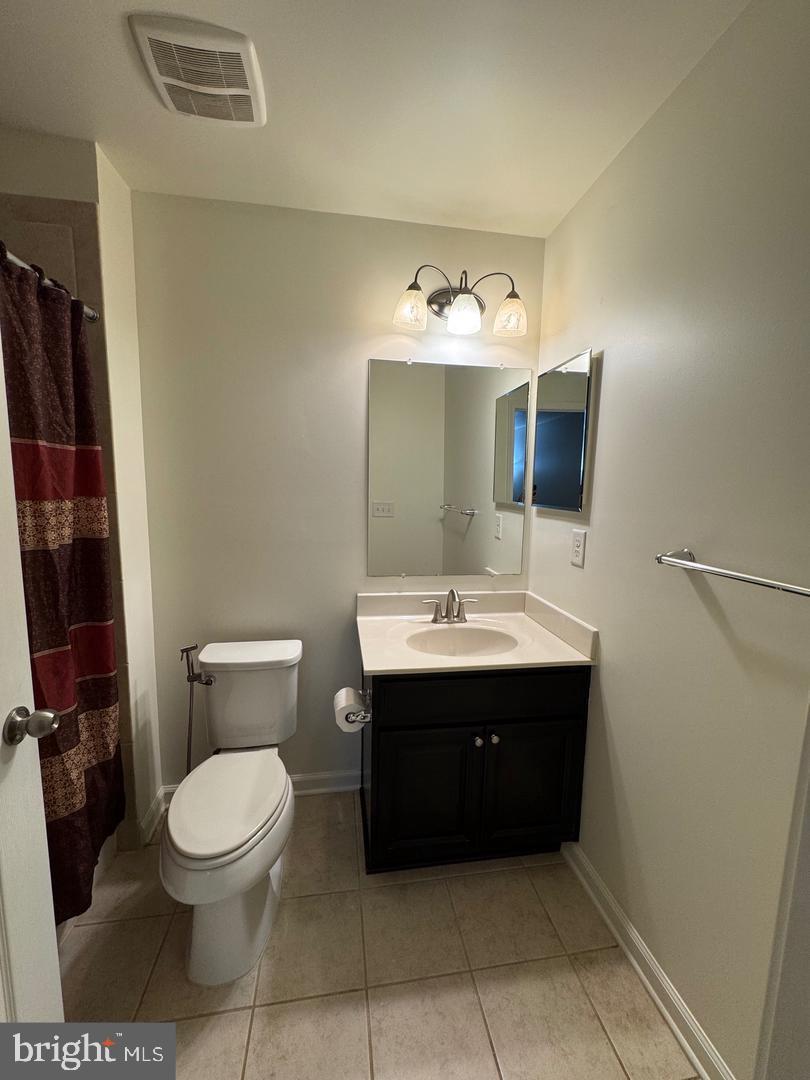 7925 Alchemy Way Elkridge, MD 21075 - Photo 8 of 46 a bathroom with a toilet sink and mirror