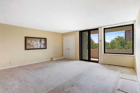 an empty room with a large window