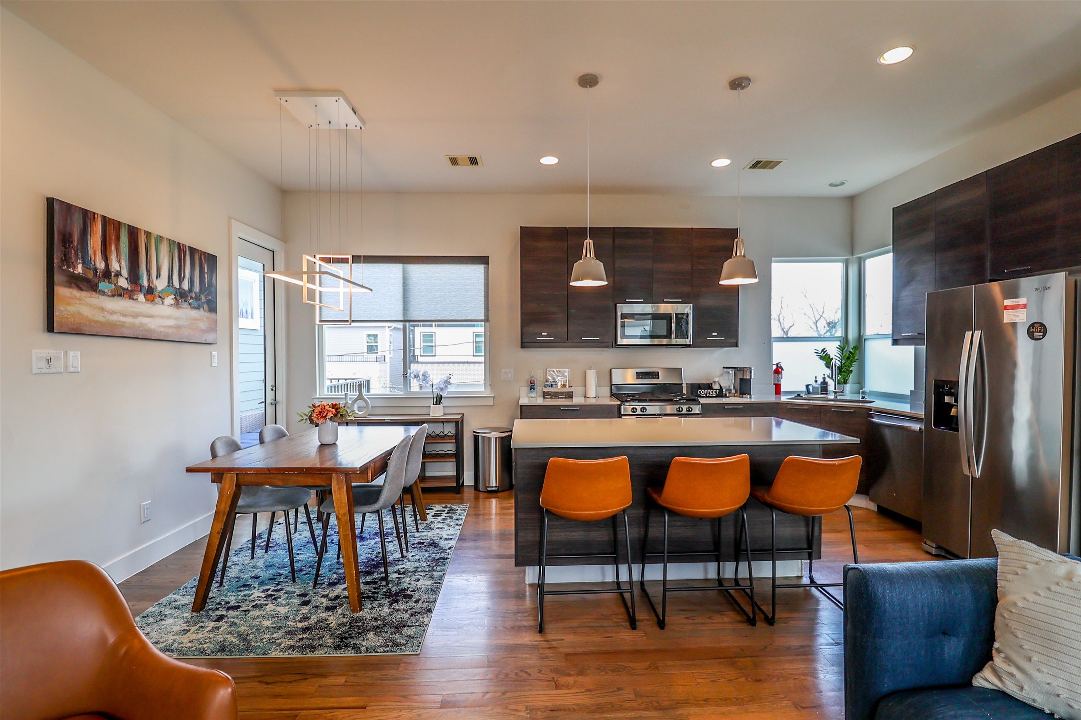2306 Wipprecht Street Houston, TX 77020 - Photo 12 of 29 a dining room with furniture a rug and wooden floor