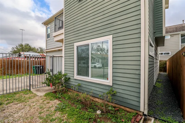 a bedroom with bed and wooden floor