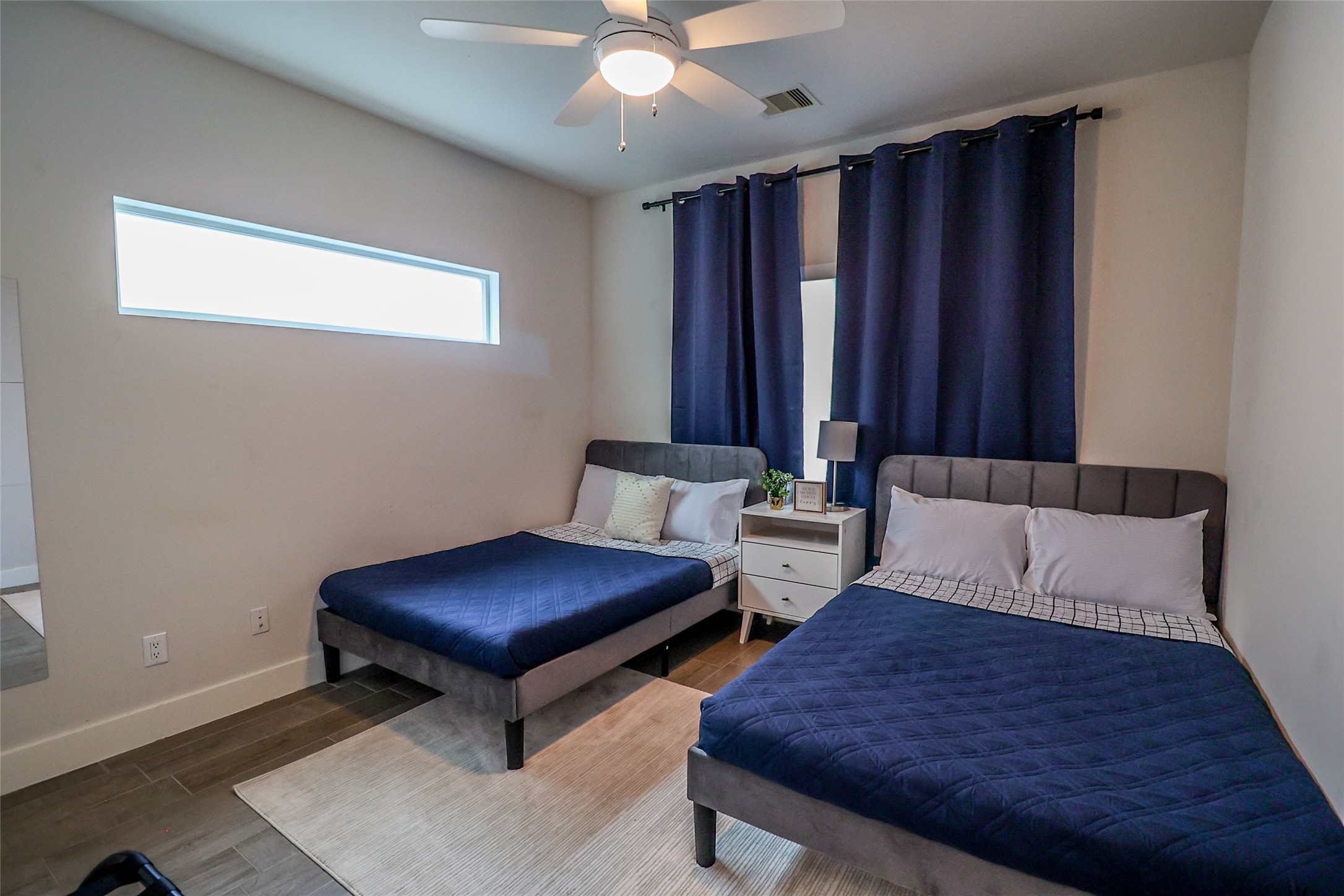 2306 Wipprecht Street Houston, TX 77020 - Photo 8 of 29 a bedroom with furniture and a large window