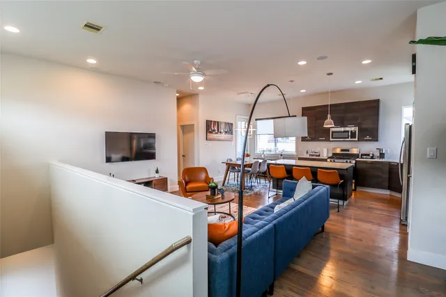 a living room with fireplace furniture and a flat screen tv