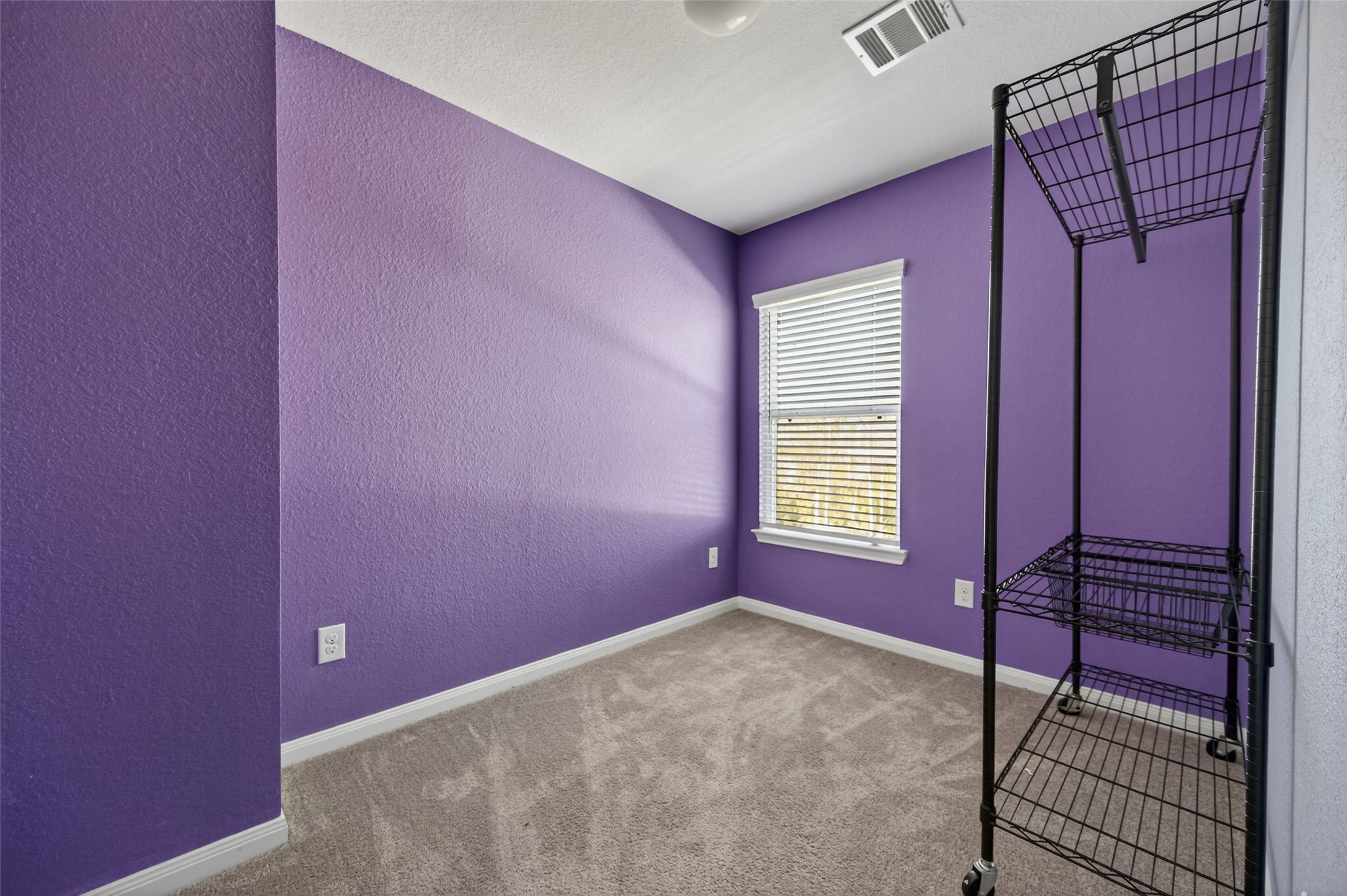 15149 Austin Road Willis, TX 77378 - Photo 18 of 31 a bedroom with a bed and a window