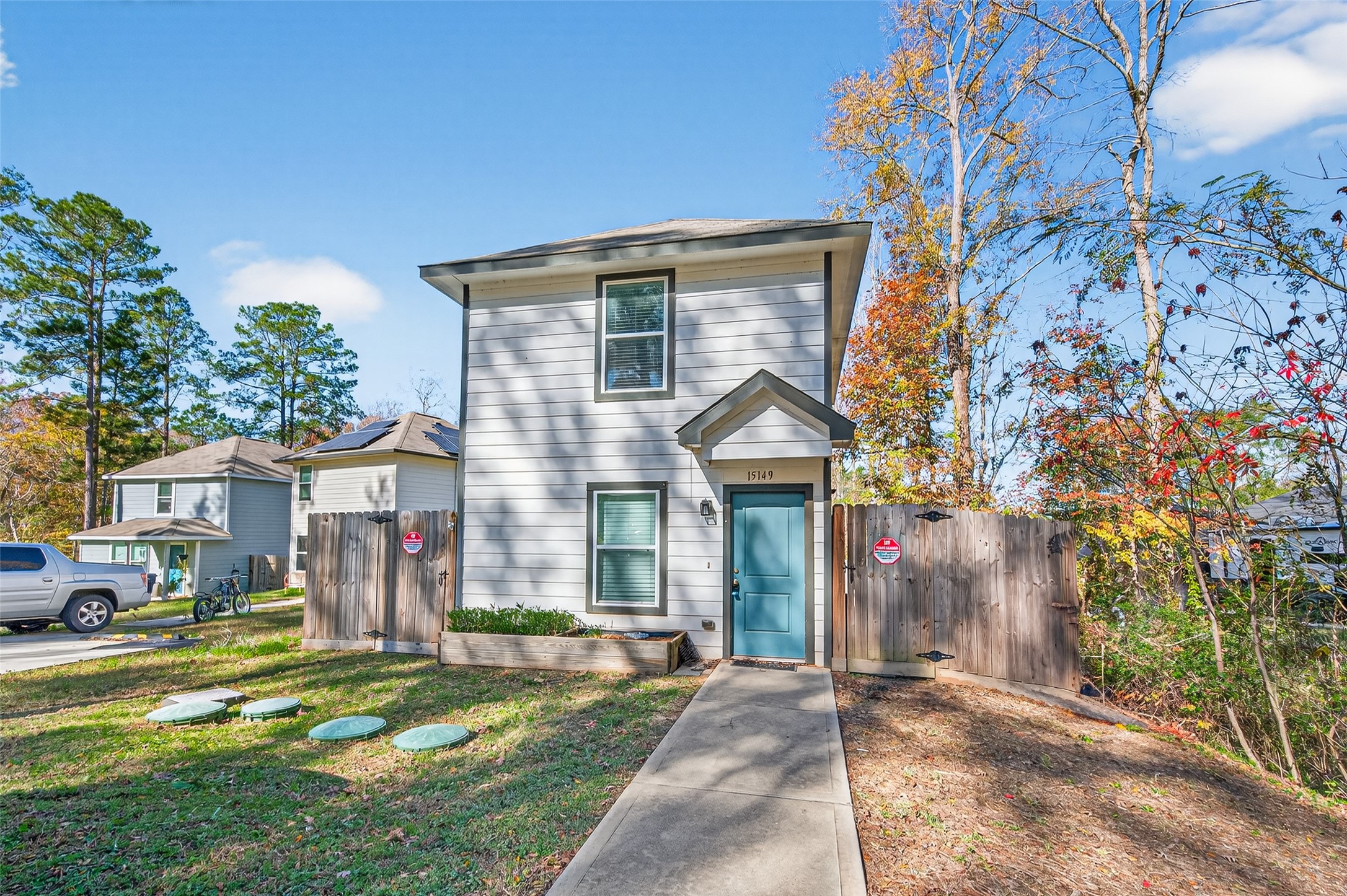 15149 Austin Road Willis, TX 77378 - Photo 2 of 31 a front view of a house with a yard