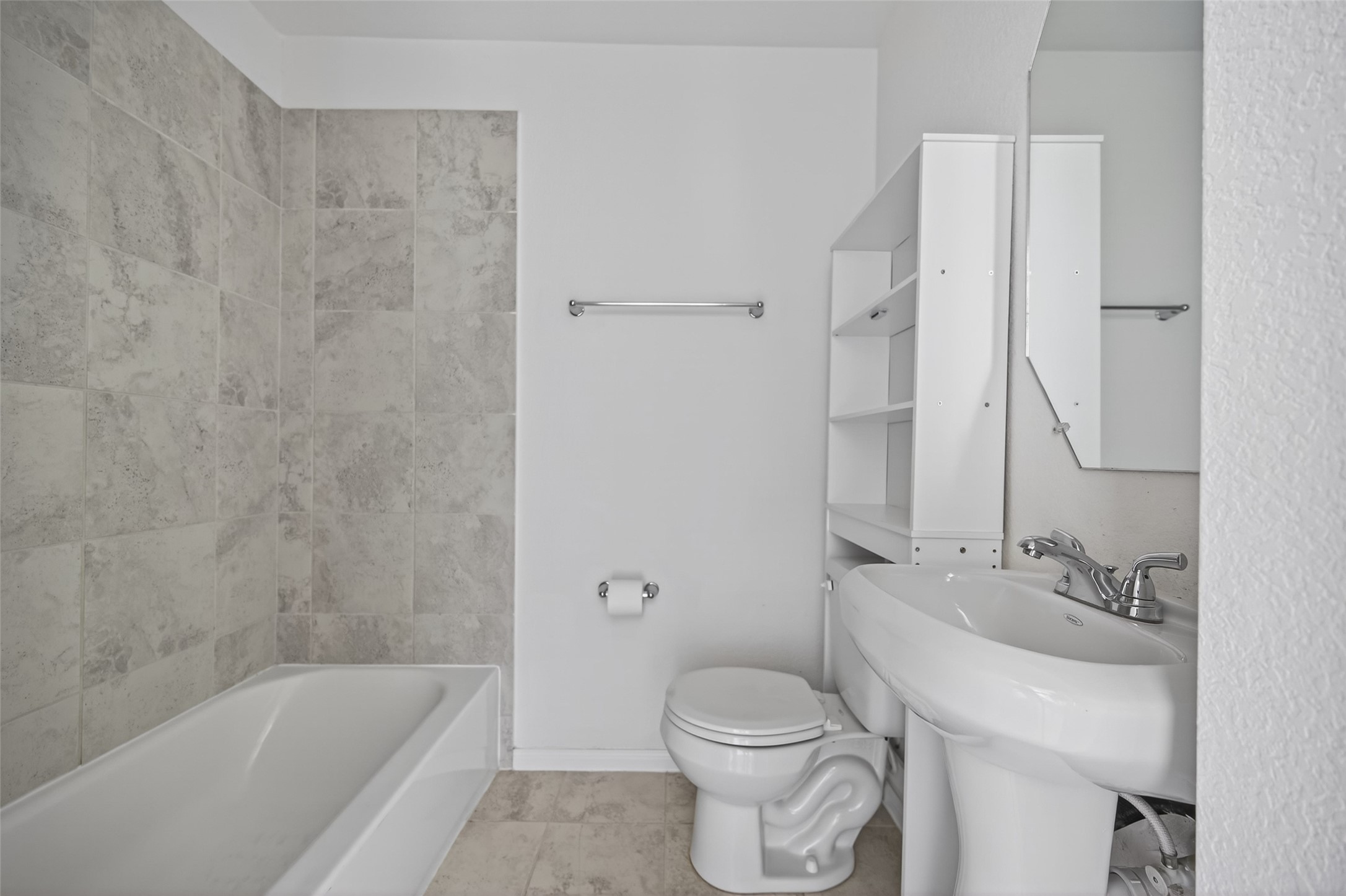 15149 Austin Road Willis, TX 77378 - Photo 23 of 31 a bathroom with a bathtub shower sink mirror and toilet