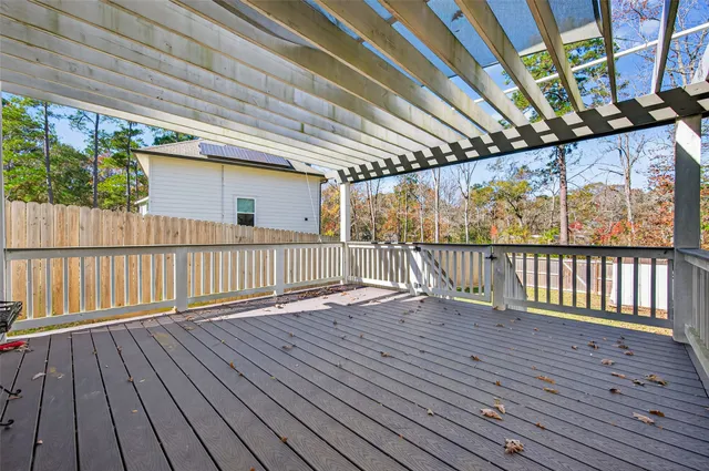 a view of balcony with wooden floor