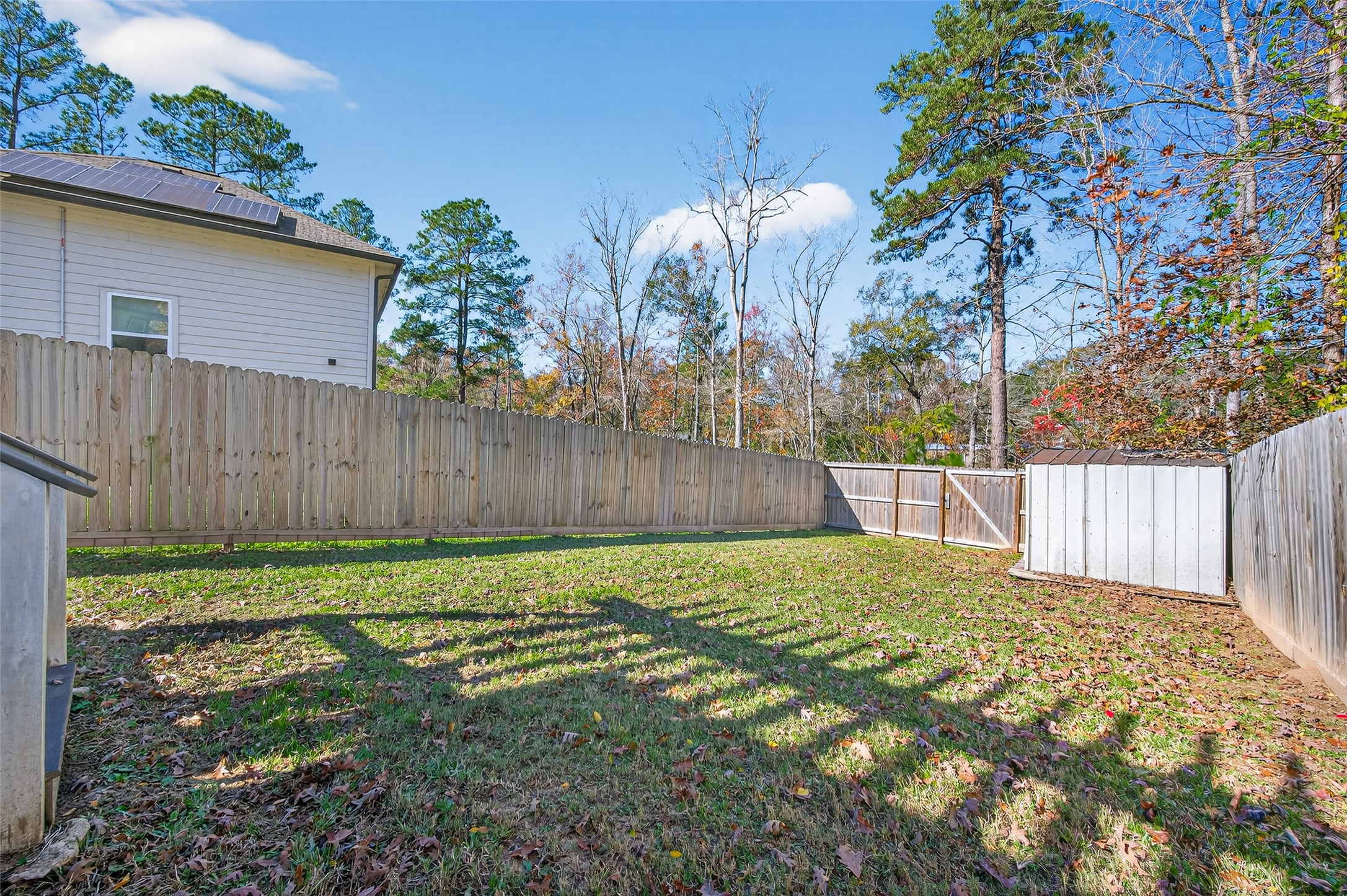 15149 Austin Road Willis, TX 77378 - Photo 29 of 31 a view of backyard with wooden fence