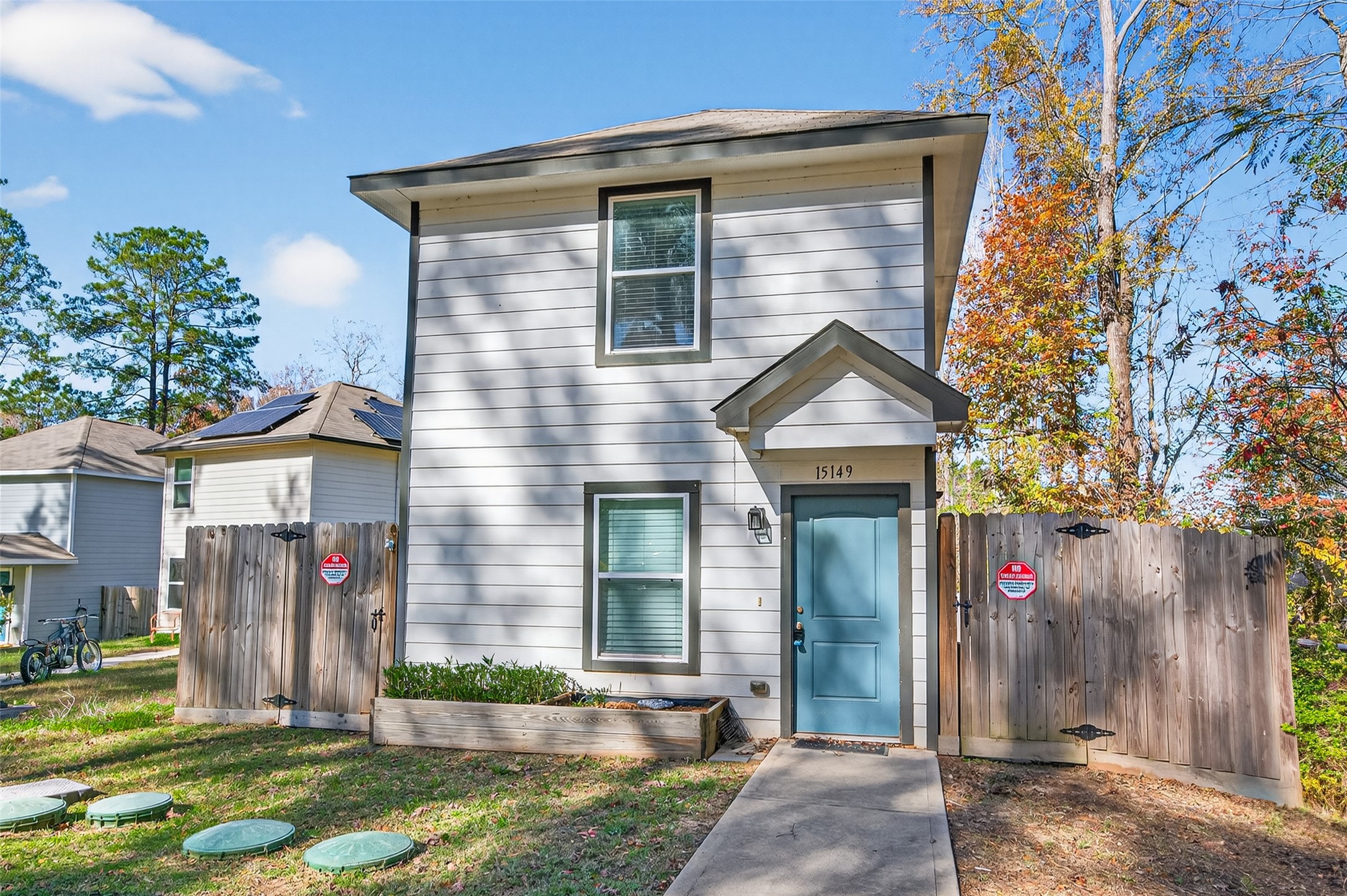 15149 Austin Road Willis, TX 77378 - Photo 3 of 31 a front view of a house with a yard and garage