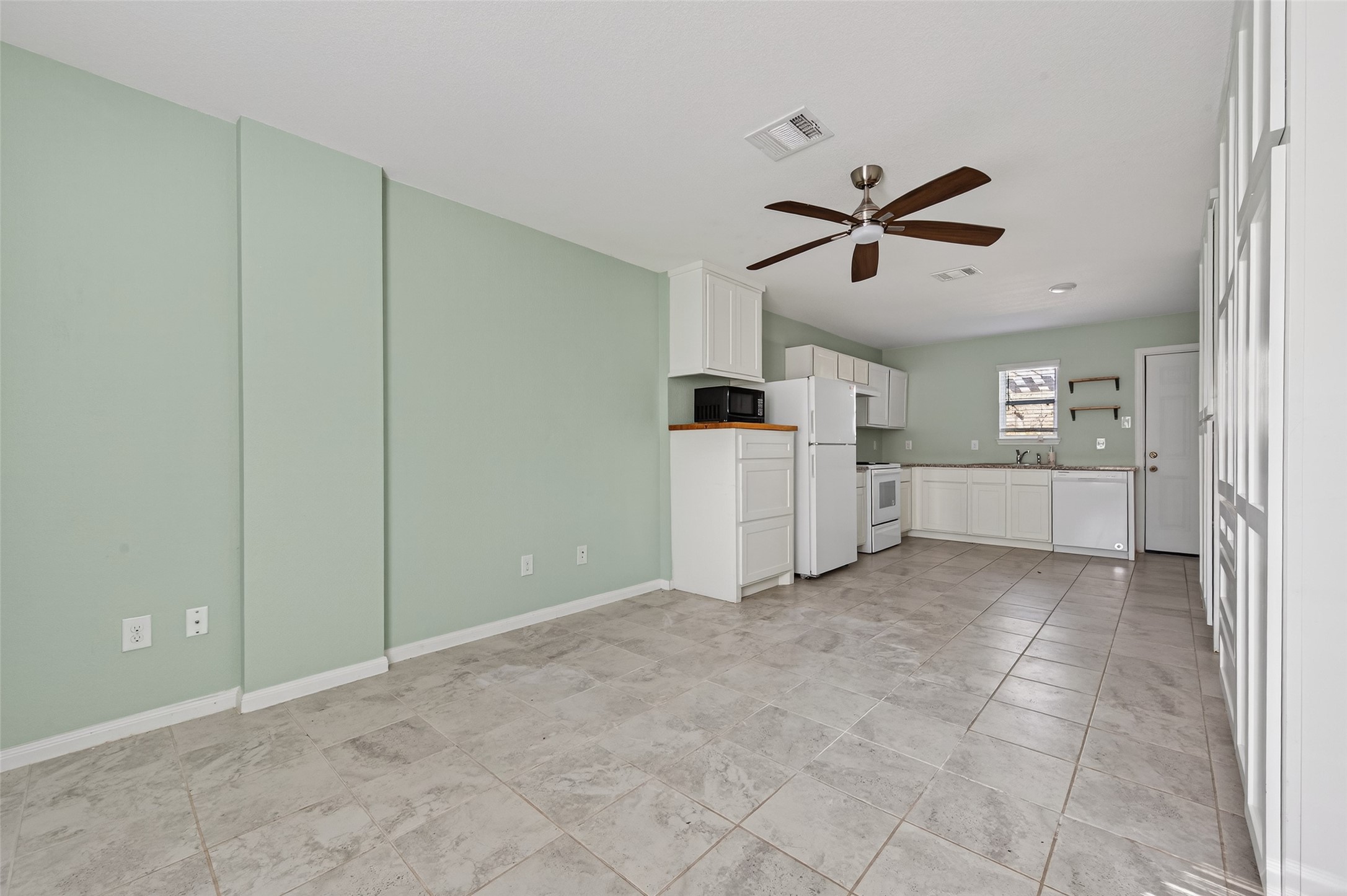 15149 Austin Road Willis, TX 77378 - Photo 6 of 31 a view of a kitchen with furniture and a kitchen