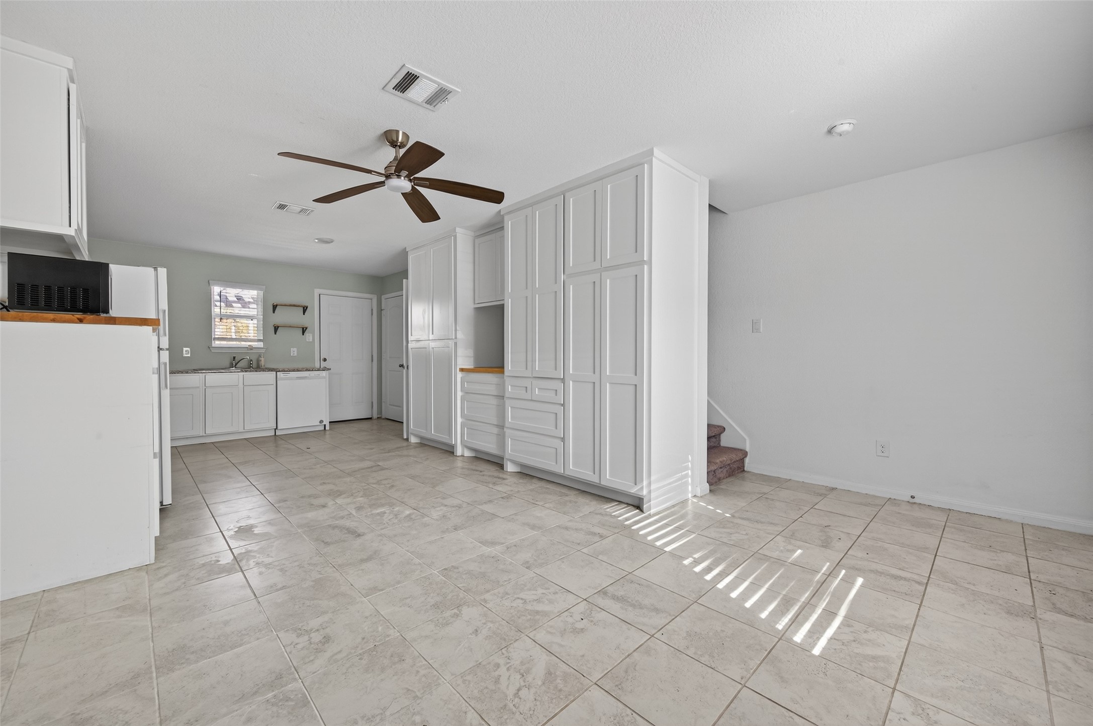 15149 Austin Road Willis, TX 77378 - Photo 7 of 31 a view of an empty room with a ceiling fan and window