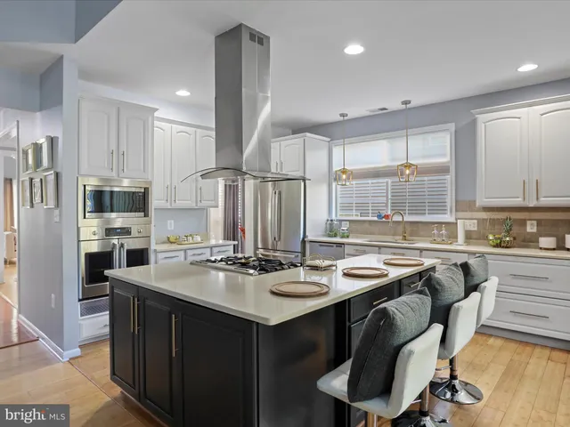 a living room with furniture fireplace and flat screen tv