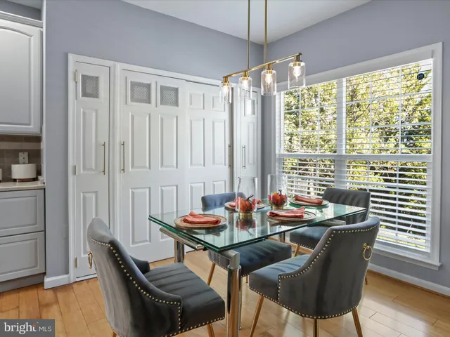 a living room with furniture a fireplace and a large mirror