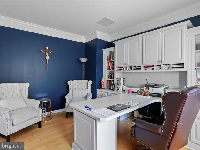 a bedroom with a bed and a ceiling fan