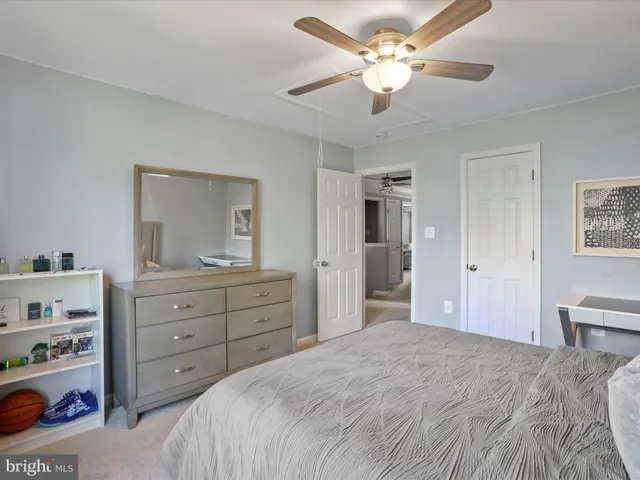 a bathroom with a double vanity sink toilet and a mirror