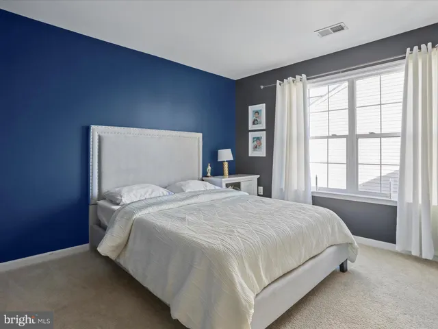 a view of balcony with wooden floor and outdoor seating