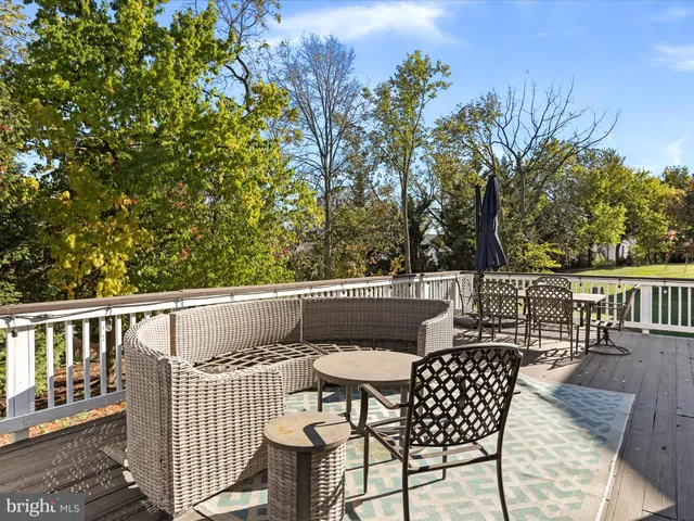 a living room with furniture and a flat screen tv with rug