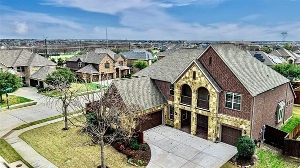 an aerial view of a house with a garden