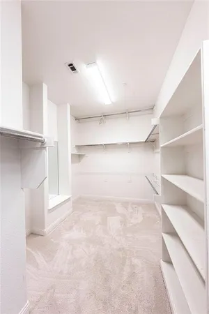 a room with two windows and furniture
