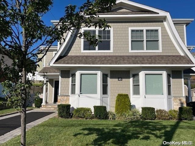 45 Linwood Road North, Unit A Port Washington, NY 11050 - Photo 1 of 1 a front view of a house with a yard