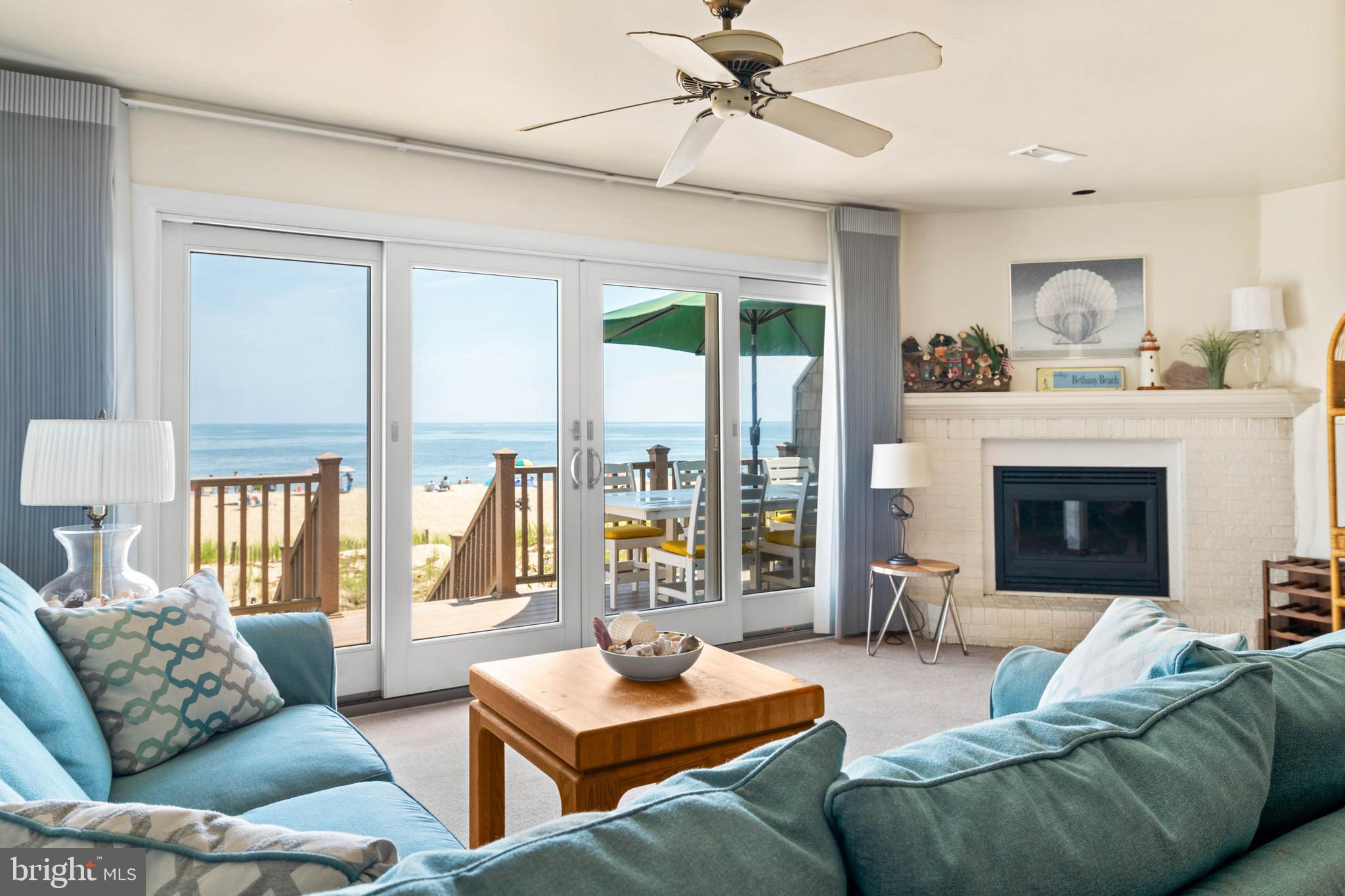 29155 Ocean Road, Unit 4 Bethany Beach, DE 19930 - Photo 16 of 63 Living Room with electric fireplace & ceiling fan