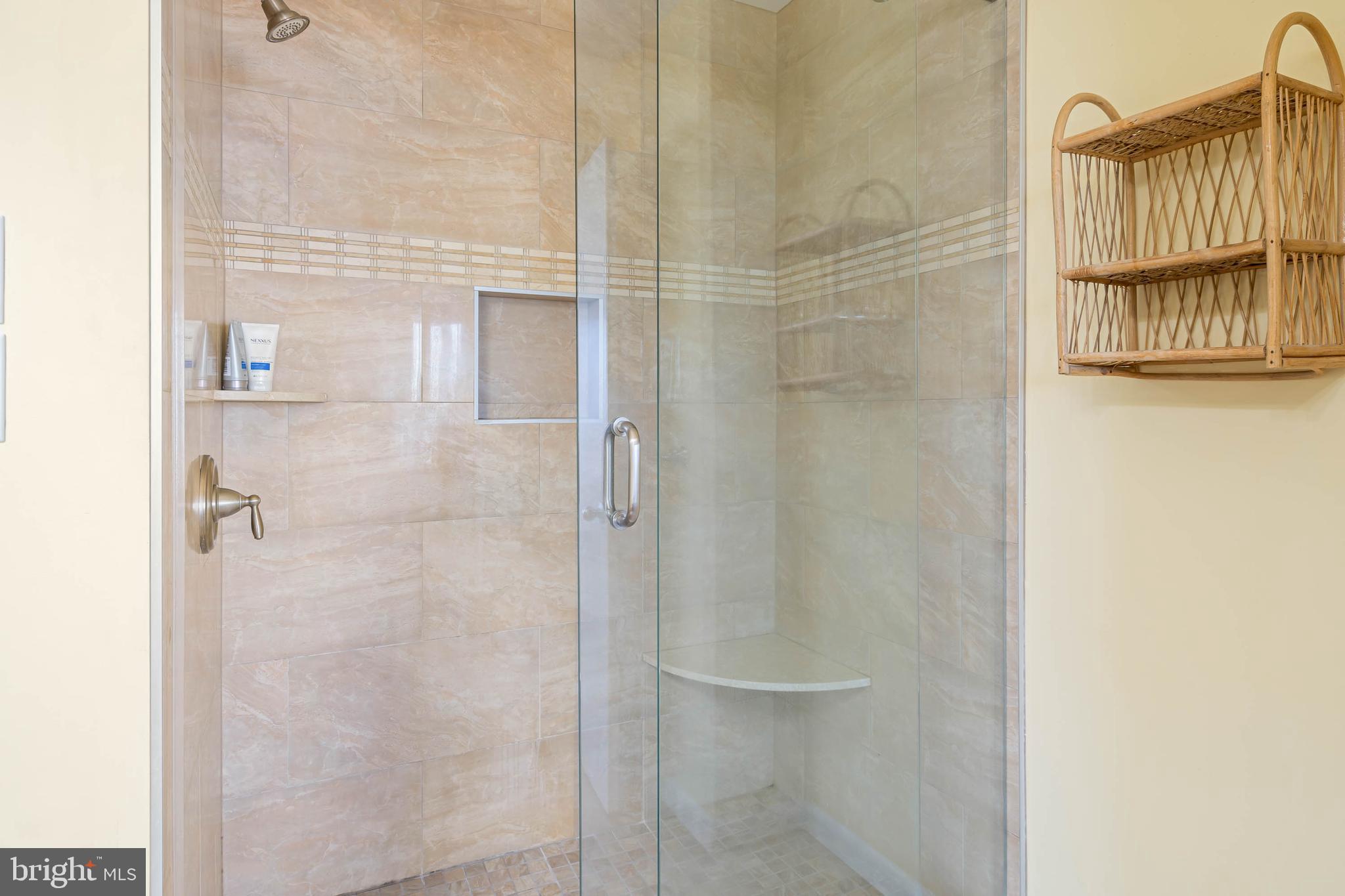 29155 Ocean Road, Unit 4 Bethany Beach, DE 19930 - Photo 34 of 63 Walk-in Shower with built-in shelf & seat