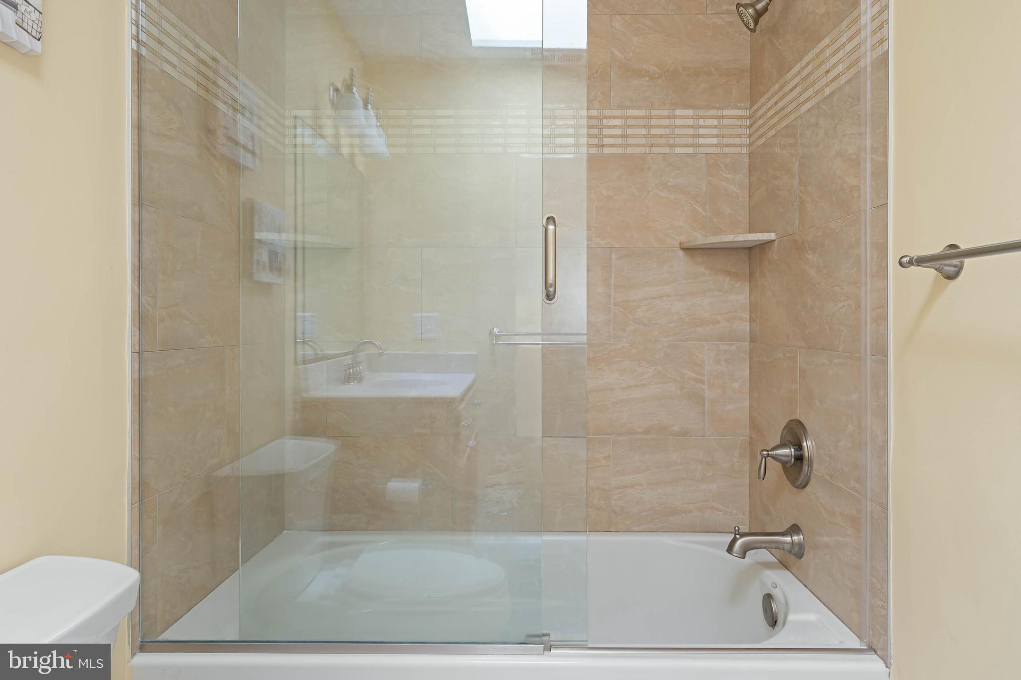 29155 Ocean Road, Unit 4 Bethany Beach, DE 19930 - Photo 40 of 63 Shower Tub with built-in shelf