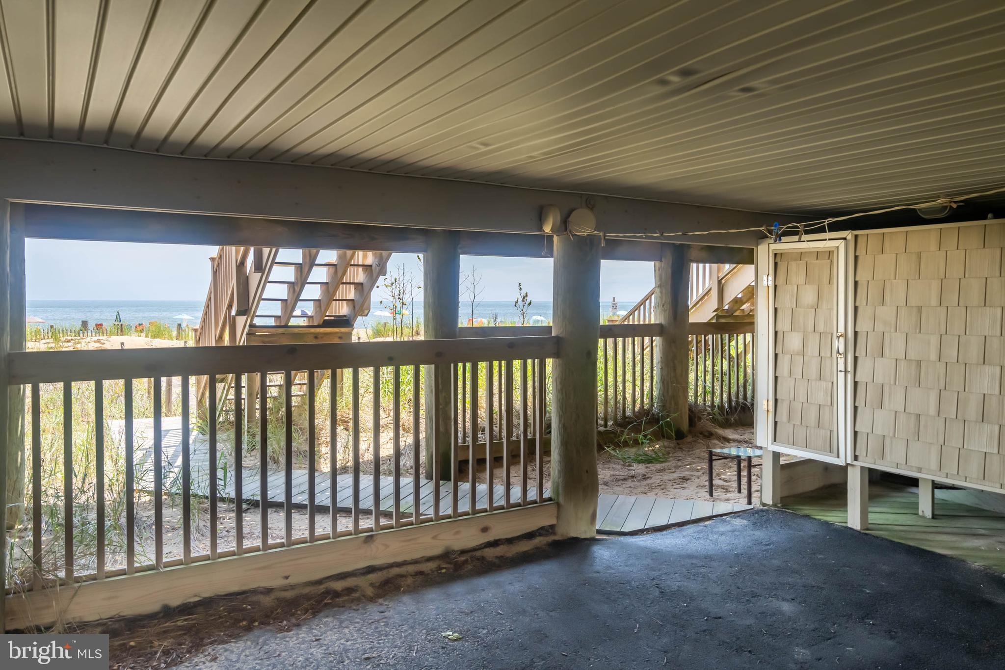 29155 Ocean Road, Unit 4 Bethany Beach, DE 19930 - Photo 9 of 63 Outdoor shower, LR stairs & path to beach