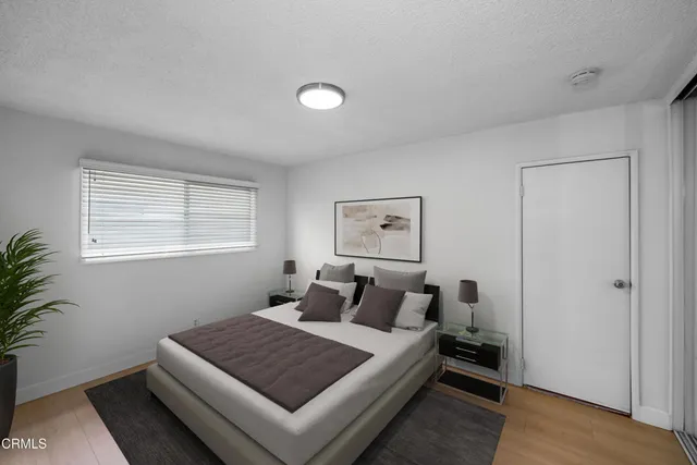 a bathroom with a toilet sink vanity and mirror