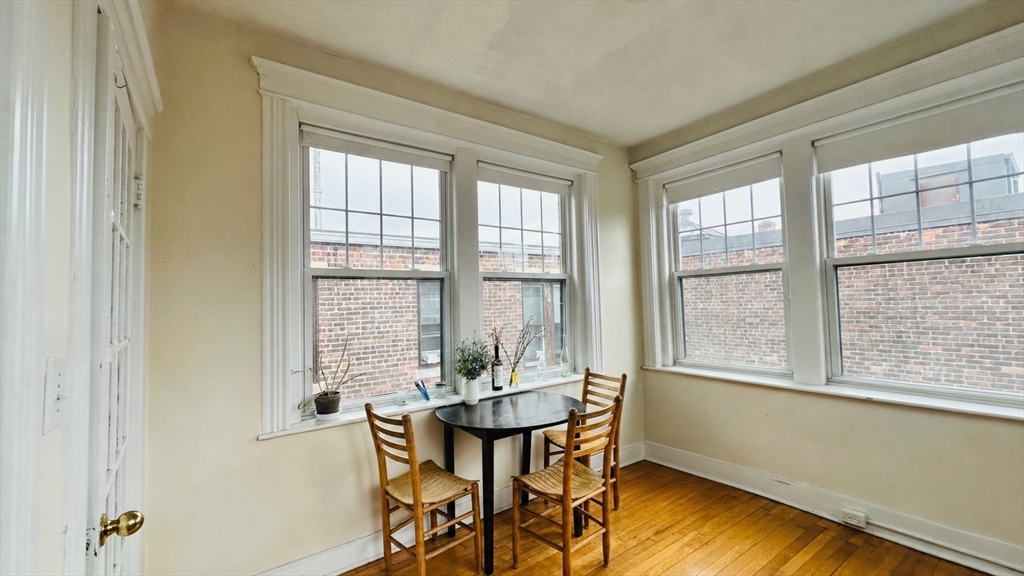 57 Alton Place, Unit 3 Brookline, MA 02446 - Photo 10 of 13 a view of a dining room with furniture window and outside view