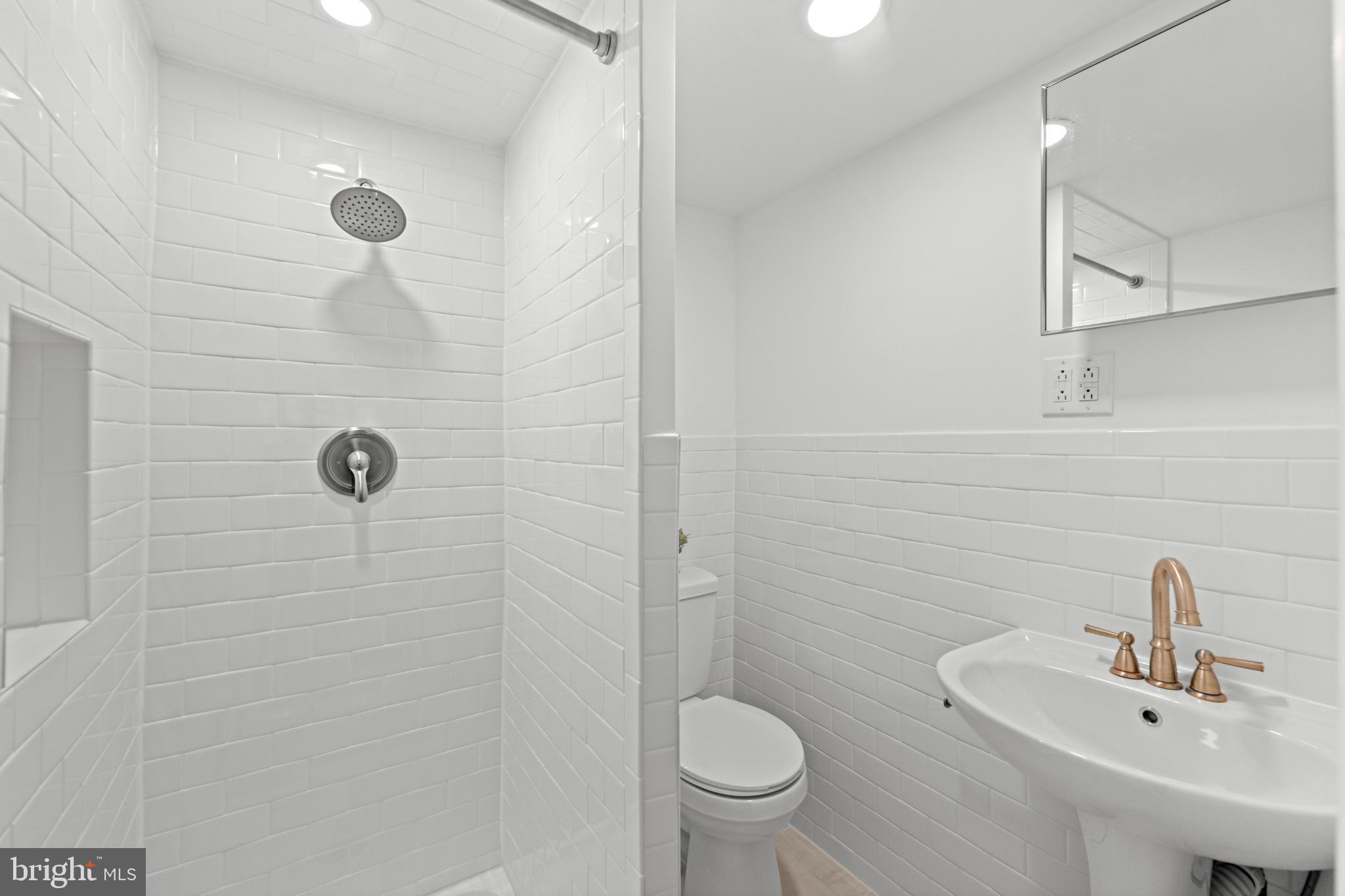 442 East Spring Avenue Ardmore, PA 19003 - Photo 66 of 72 Sleek modern bathroom with elegant fixtures.