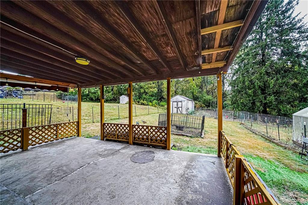 421 Sharon Road Coraopolis, PA 15108 - Photo 20 of 25 Spacious covered patio, ideal for outdoor relaxation and entertaining.