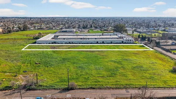 a view of a swimming pool with lawn chairs