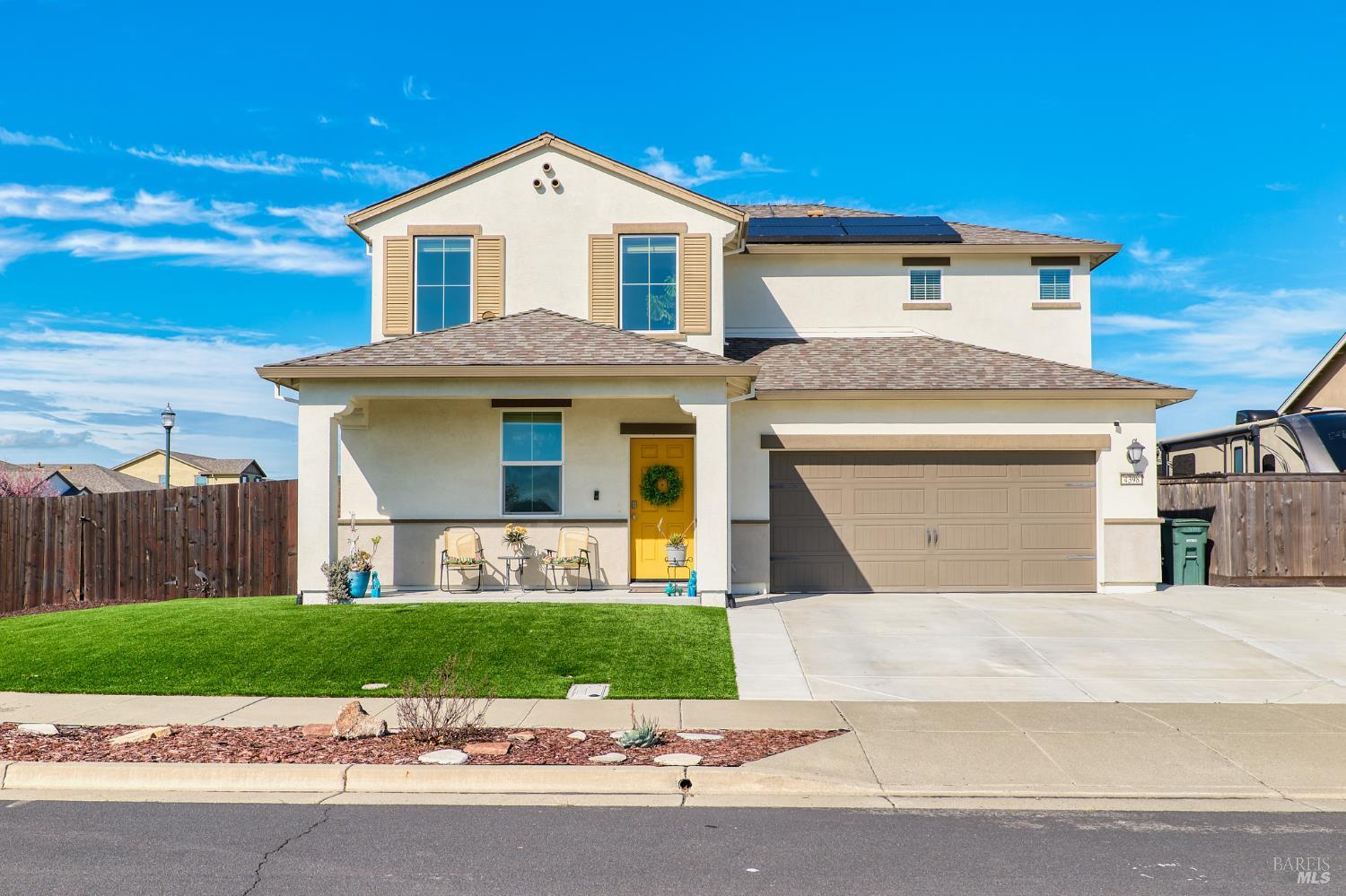 4398 Artisan Path, Unit 724 :2 Rio Vista, CA 94571 - Photo 1 of 24 a front view of a house with a yard and garage