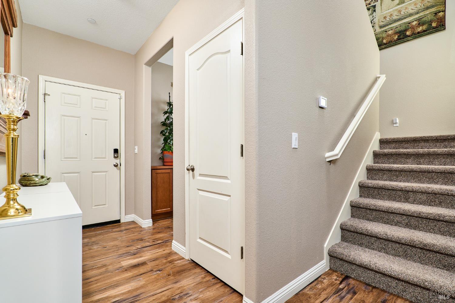 4398 Artisan Path, Unit 724 :2 Rio Vista, CA 94571 - Photo 14 of 24 a view of a hallway with wooden floor and entryway