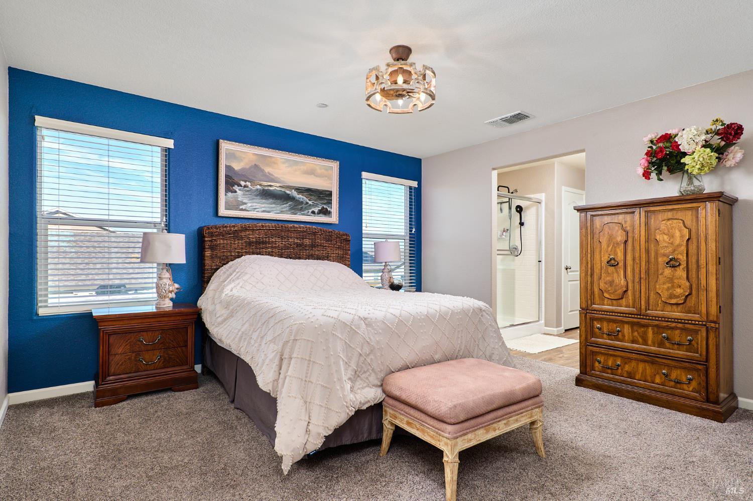 4398 Artisan Path, Unit 724 :2 Rio Vista, CA 94571 - Photo 21 of 24 a spacious bedroom with a bed and a chandelier