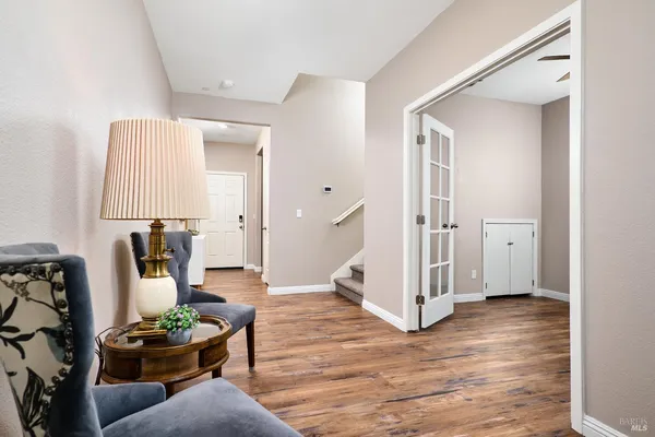a view of a livingroom with furniture and a wooden floor