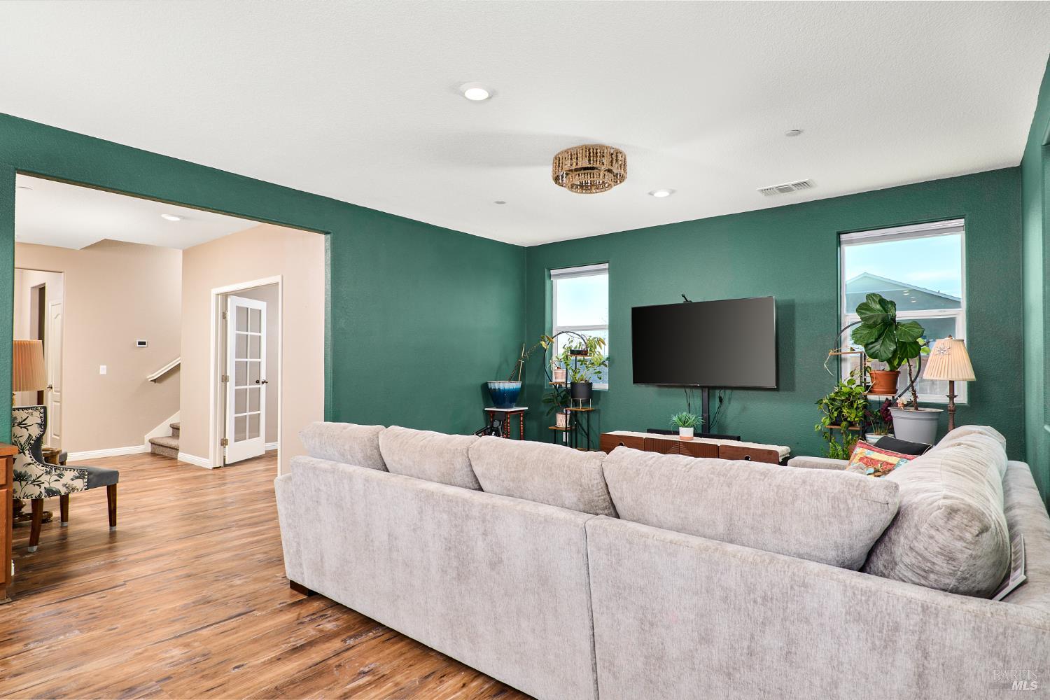 4398 Artisan Path, Unit 724 :2 Rio Vista, CA 94571 - Photo 8 of 24 a living room with furniture and a flat screen tv