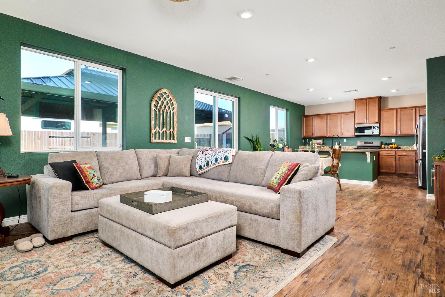 4398 Artisan Path, Unit 724 :2 Rio Vista, CA 94571 - Photo 9 of 24 a living room with furniture and a large window