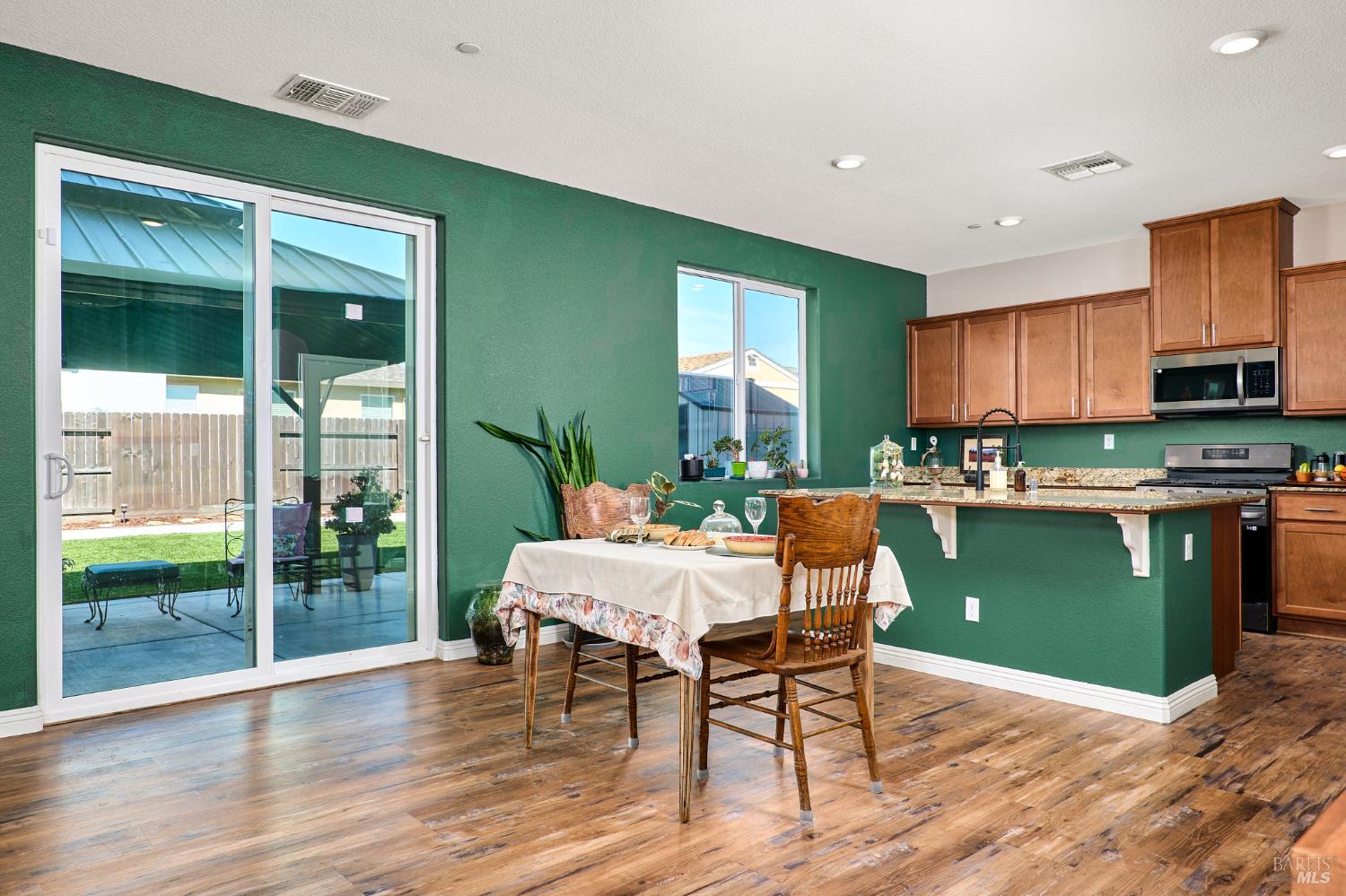 4398 Artisan Path, Unit 724 :2 Rio Vista, CA 94571 - Photo 10 of 24 a kitchen with a table chairs and a refrigerator