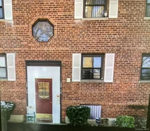 a brick building with a door and a window