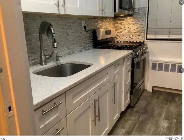 a kitchen with a sink and cabinets