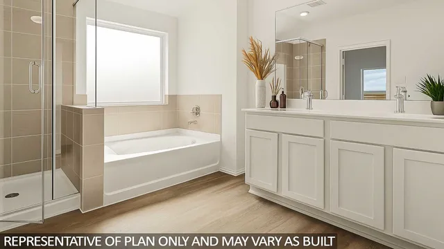 a spacious bathroom with a tub shower and sink