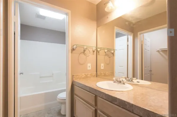 a bathroom with sink toilet and bathtub