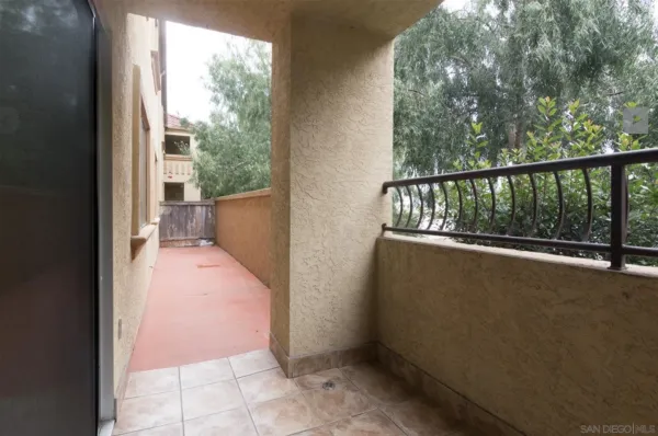 a view of a patio with couches and potted plants