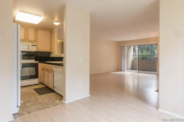 a kitchen with stainless steel appliances granite countertop a stove and a microwave