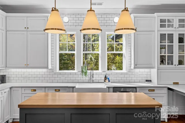 a kitchen with a sink and a window